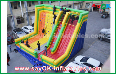 Adult Inflatable Slide 9.5*7.5*6.5m Warna-warni Inflatable Bouncer Slide Dengan Mendaki Dinding Untuk Taman Hiburan